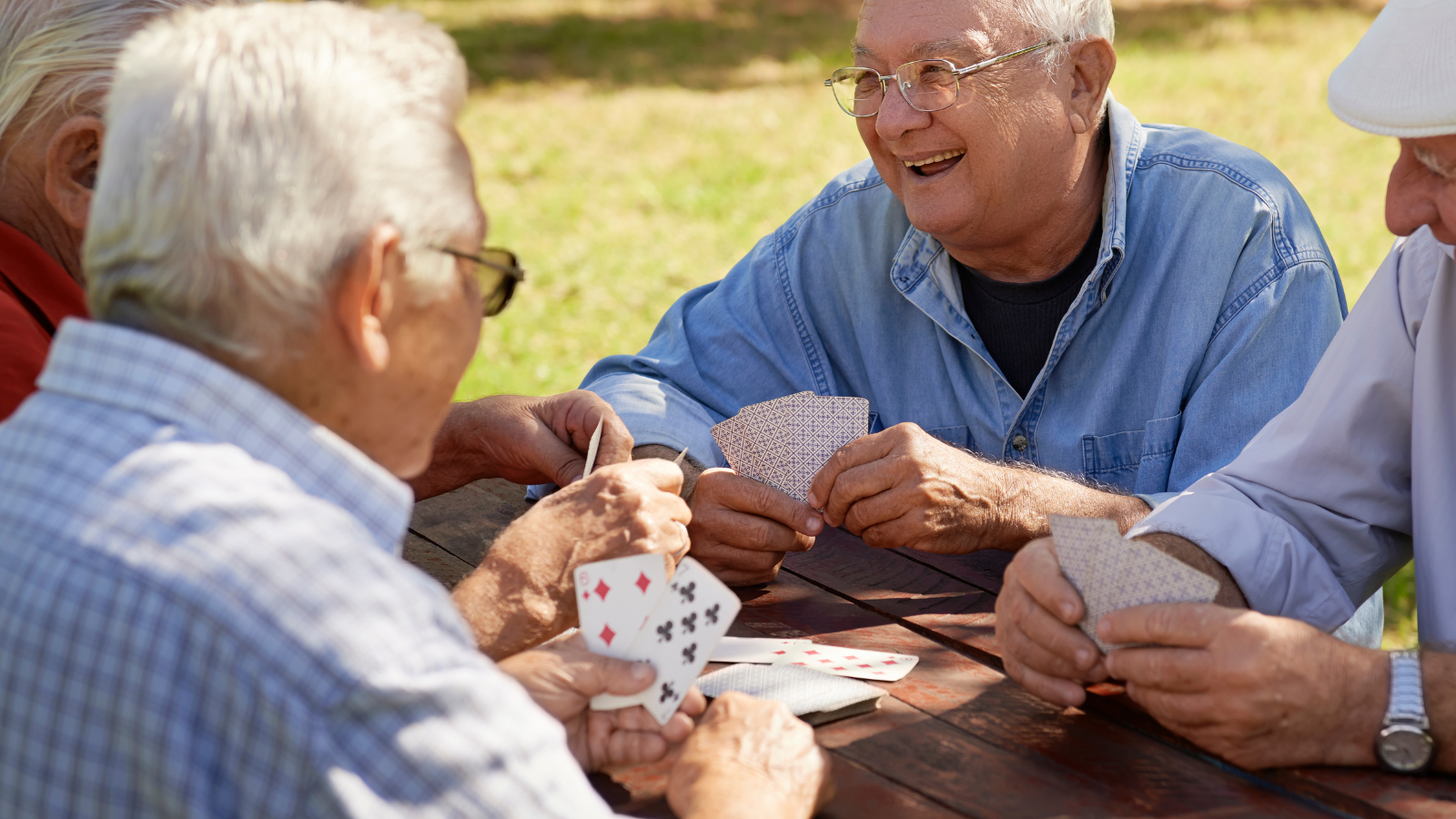 older men playing cards together